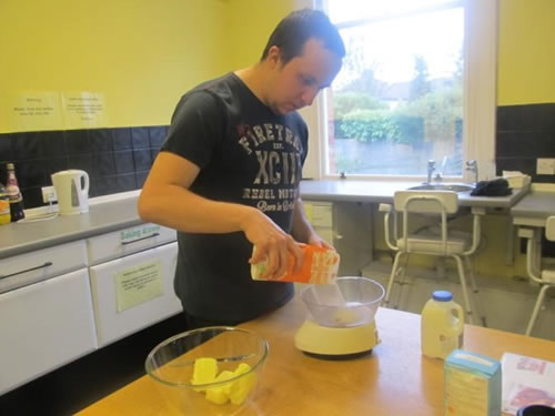 Photo showing Mark baking in the Hub kitchen